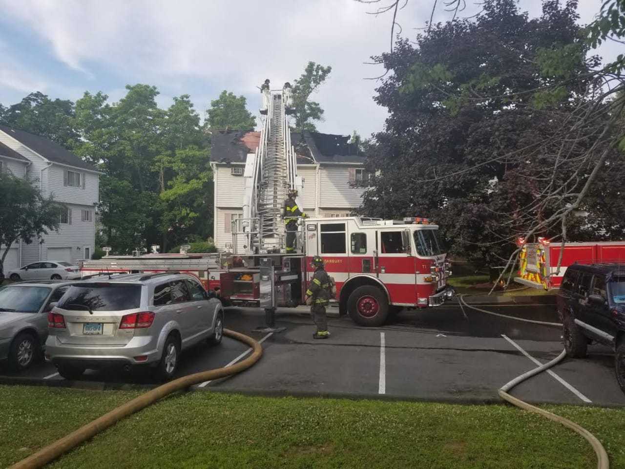Danbury firefighters wrap up following a three-alarm fire.