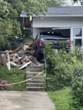 Driver Trapped, Charged After Crashing Pick-Up Into MD Home