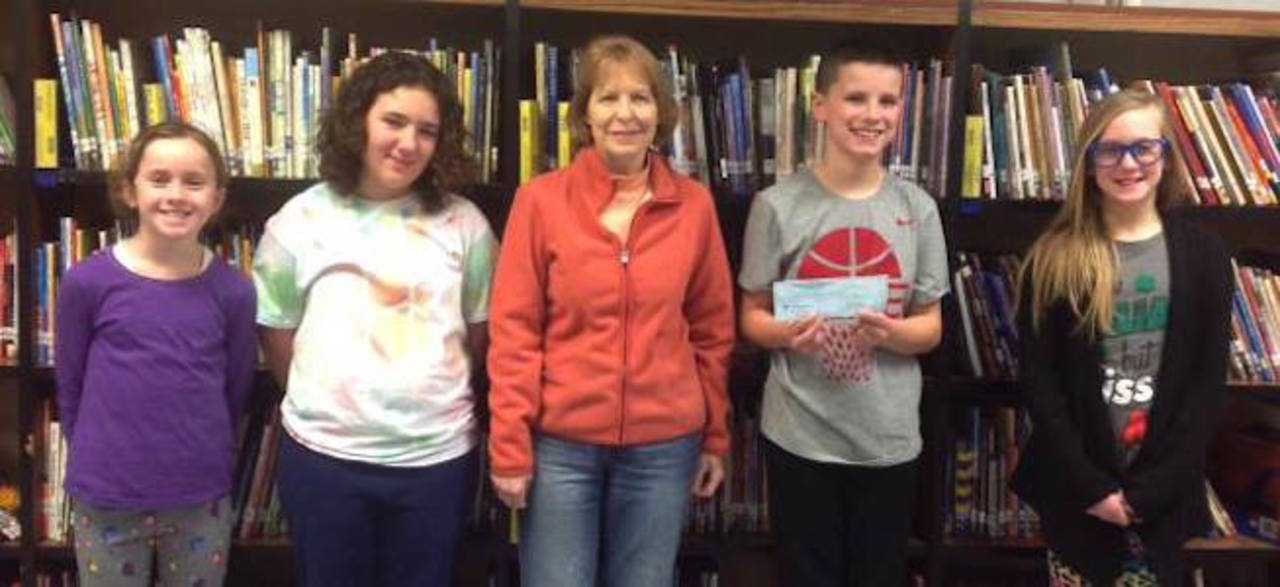 West Milford students Hailey Golding, Cassidy Clinton, Valerie Lucarello and Robert Fiorilla presented the check to Glory Bracken of the West Milford Animal Shelter.