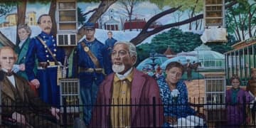 A Western Massachusetts town known for its out-of-the-box programs and solutions to local and national issues is eyeing the creation of an art tax. Pictured here is a mural in Amherst.
