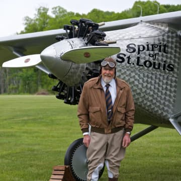 The pilot with the replica plane.