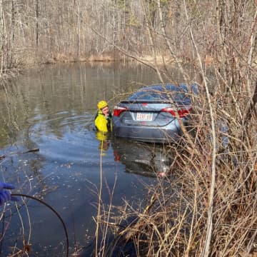 An elderly man was rescued by first responders after crashing into a lake in Western Massachusetts.