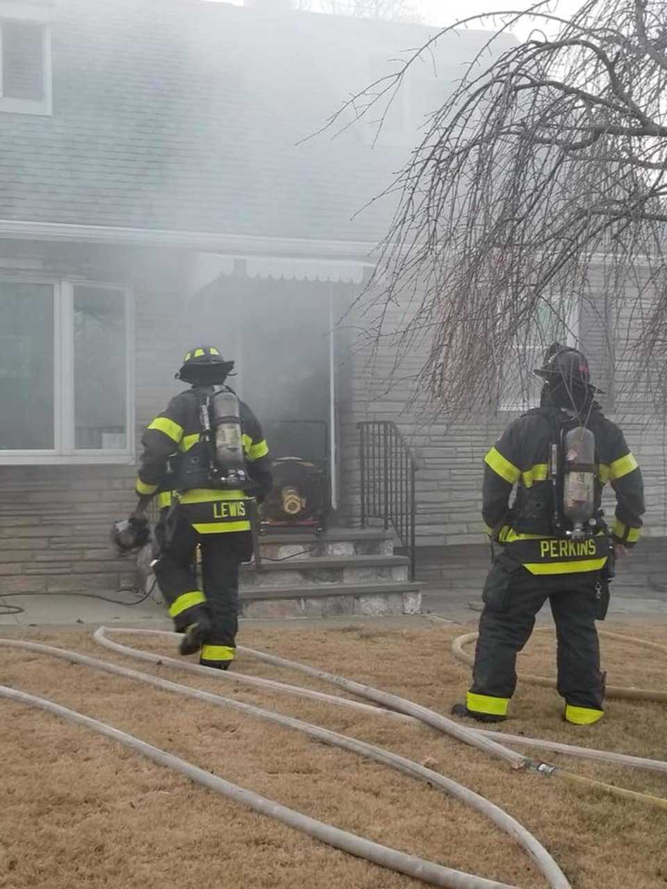Danbury firefighters extinguish a blaze in a kitchen and clear smoke from a home on Sixth Street.