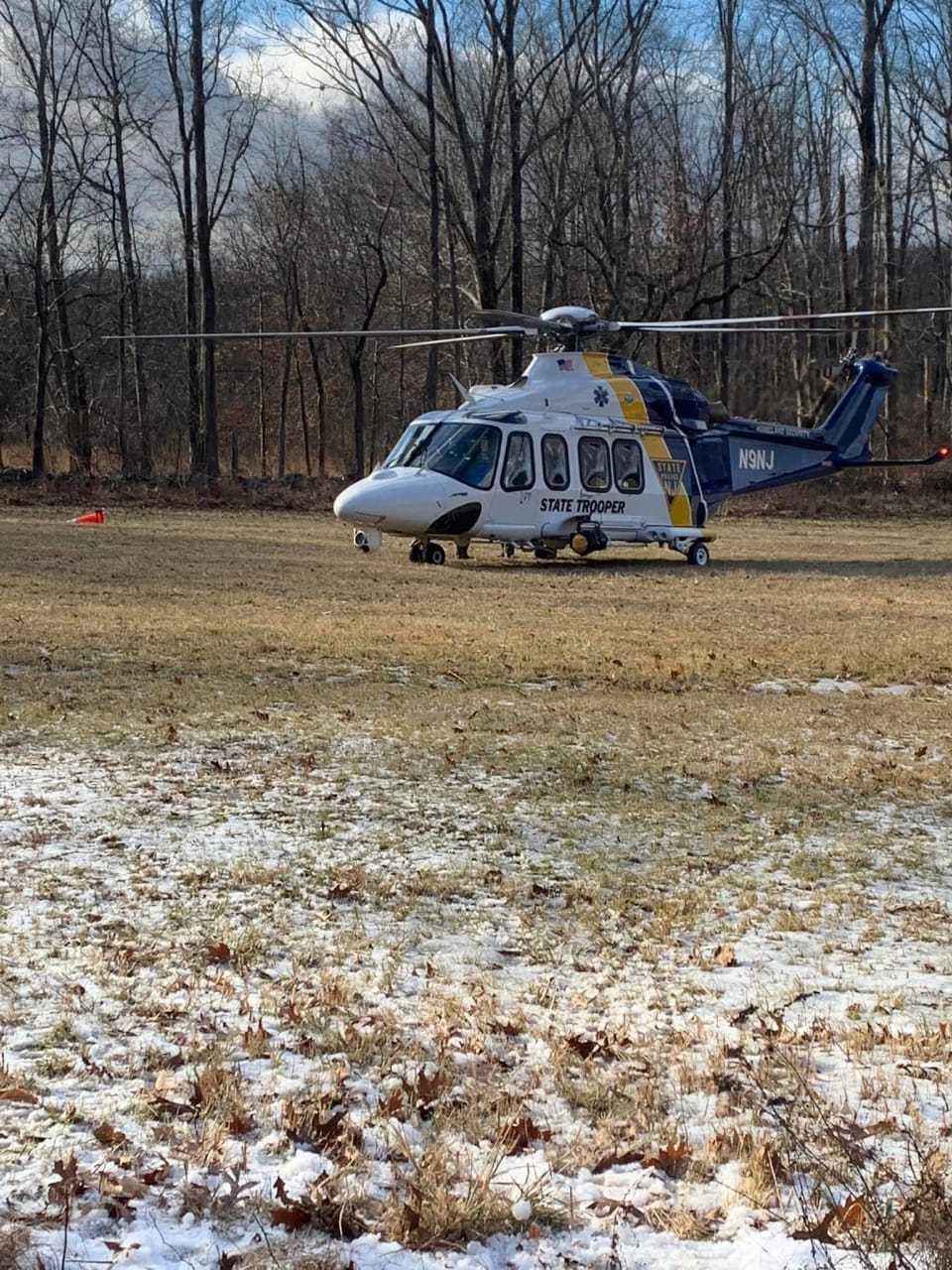 A 58-year-old man was airlifted with serious injuries after getting trapped underneath a tree in Hunterdon County Tuesday afternoon, state police confirmed.