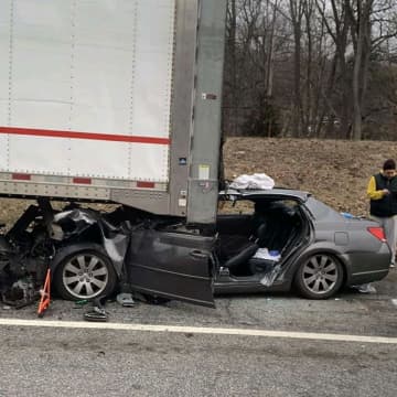 A man who was critically injured after hitting a tractor-trailer has been identified by police.