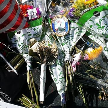 A Newtown officer left a department patch at an Orlando memorial.