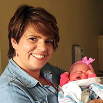 <p>Amanda Keane posed with her new niece earlier this summer.</p>