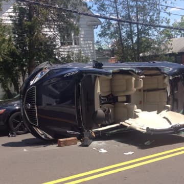 An elderly woman was injured in a rollover crash in Greenwich on Sunday.
