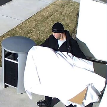 This unidentified man took two TVs from a Wayne hotel, police said.