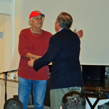 John Farr, Bedford Playhouse's Founder, greets Bedford resident, Chevy Chase.