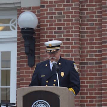 New Canaan Fire Chief John Hennessey leads the Sept. 11 remembrance ceremony on the steps of Town Hall Friday.
