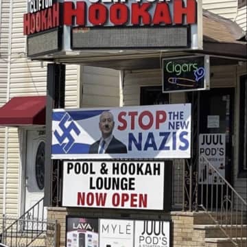 A sign outside of Clifton Hookah implies that the Jewish people are the "new Nazis," and includes a swastika.