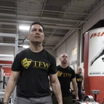 Wood-Ridge's Jeff Geisler deadlifts at the Parisi Speed School. Behind him are Paramus' Glenn Pagano and River Vale's Frank Saraceni, recently retired. Geisler was the first of the police officers to join TFW. Then slowly, more followed suit.