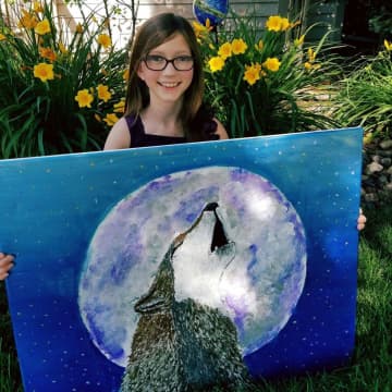 Ten-year-old Bria Shay Neff has raised more than $2,000 for the Wolf Conservation Center in South Salem.