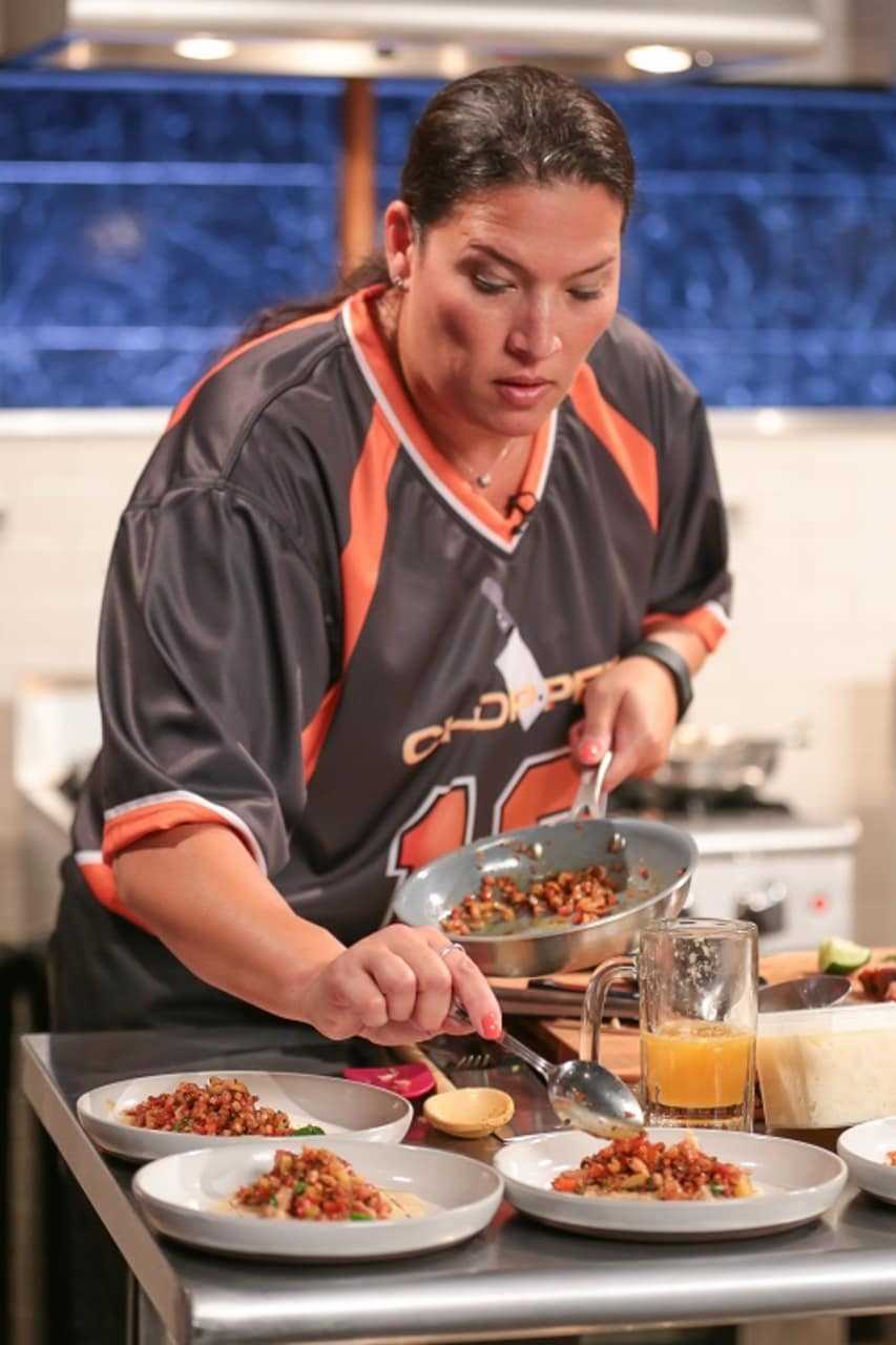 Ossining's Gina Paterno Gray plates food while competing in the Tailgate Greats segment of the Food Network show "Chopped" earlier this month.
