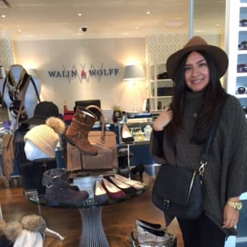Salesperson Minerva Flores of Walin & Wolff models some fall items. 