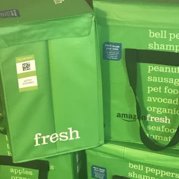 AmazonFresh orders are delivered in bright green tote bags.