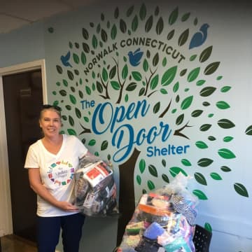 Lucy Langley, of The Undies Project, delivers donations from Undie Sunday to Open Door Shelter in Norwalk.