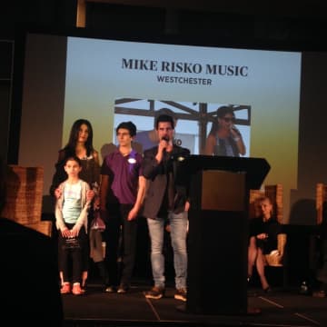 Mike Risko, owner of the Ossining  music store and school that bears his name, with his wife Miriam and their children. The Risko family received an award honoring the most outstanding family-owned businesses in Westchester.