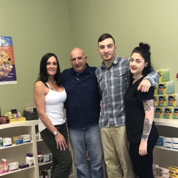 The Delillo family, owners of Main Street Rx in Newtown.
