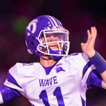 Darien High School's Tim Graham returns at quarterback for the Blue Wave, who are the defending conference champions.