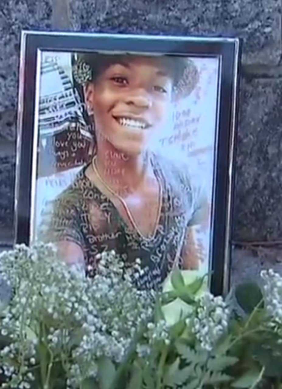 A photograph of Tahj Robinson in an impromptu memorial set up near Barhardt Park by friends of the slain teen.