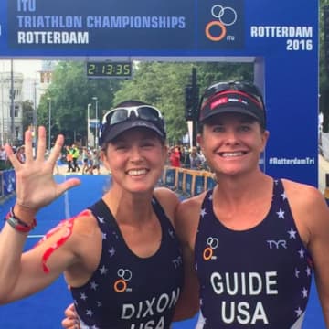 Greenwich's Amy Dixon, left, and celebrates with guide Susanne Martineau Davis after finishing fifth Sunday at the ITU World Championships in Rotterdam.