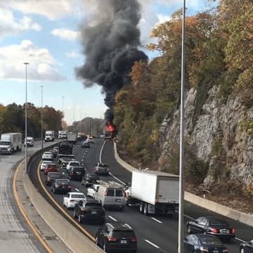 The truck fire as it was fully engaged on I-95 in Larchmont.