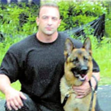 A file photo of Nick Tartaglione with a K-9 officer when Tartaglione was a member of the Briarcliff Manor Police Department.