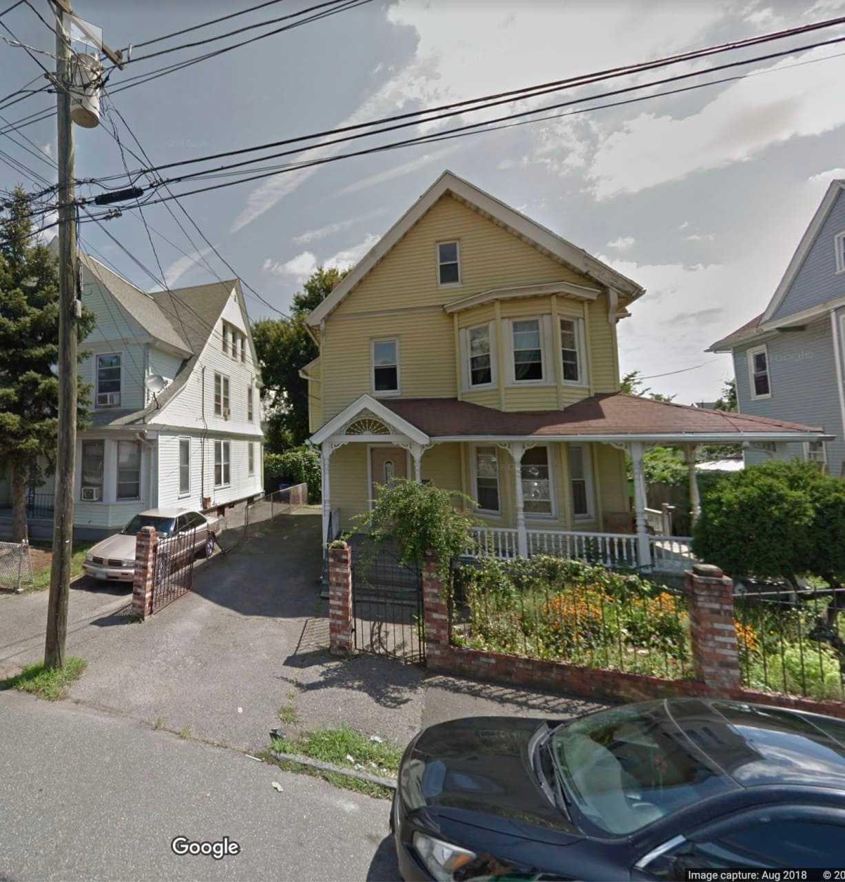 A woman was shot and killed while looking out a second-floor window of her home.
