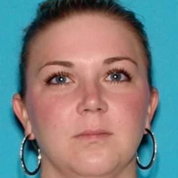 Elizabeth A. Holmes, 37, is wanted out of Mansfield on charges of child neglect, two counts of drug possession and possession of drug paraphernalia, township police said.