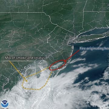 The area circled from this satellite view shows high concentrations of smoke due to a wildfire at Bass River State Forest, according to the National Weather Service.