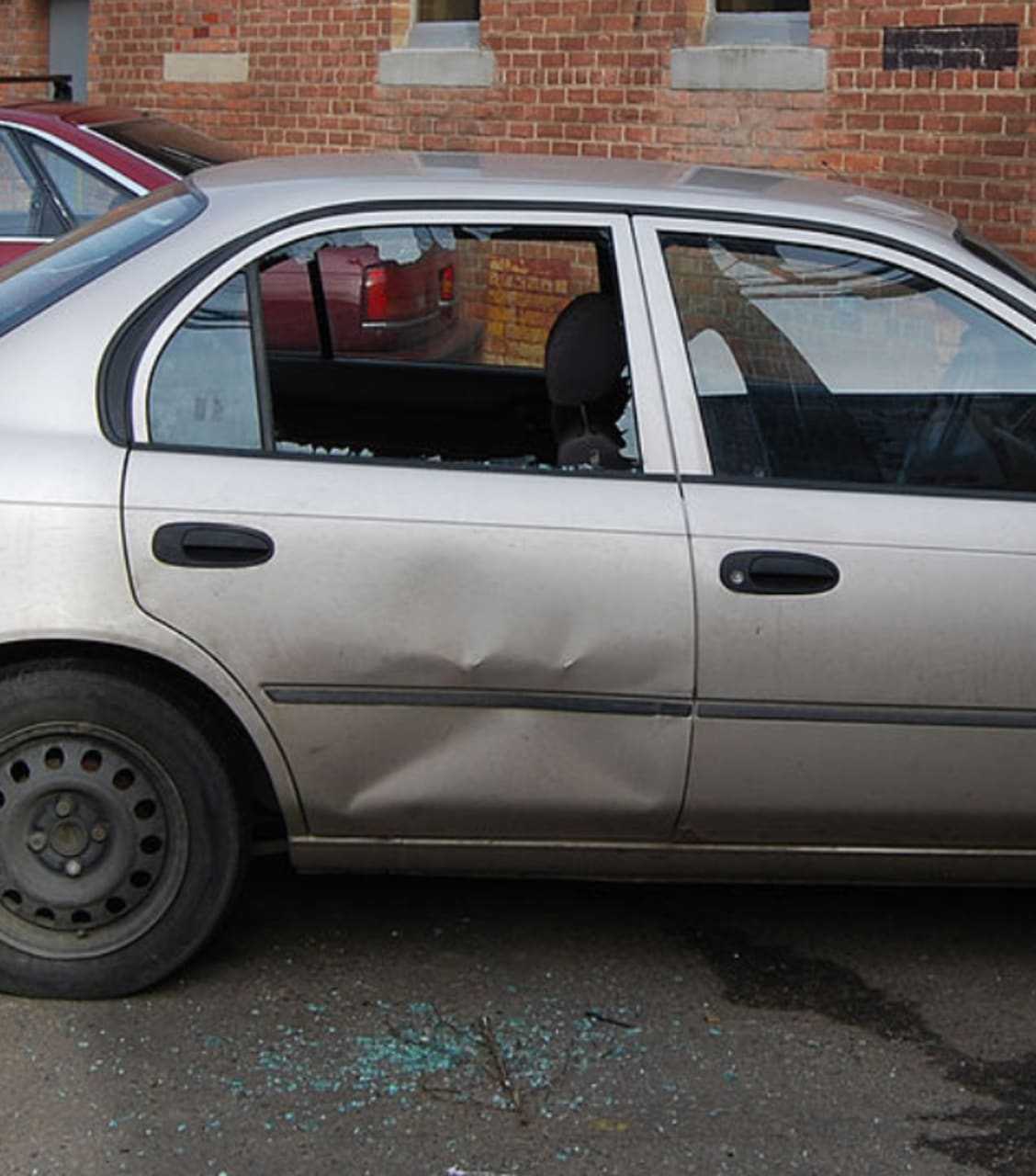 Photo illustration, a vehicle with a broken window