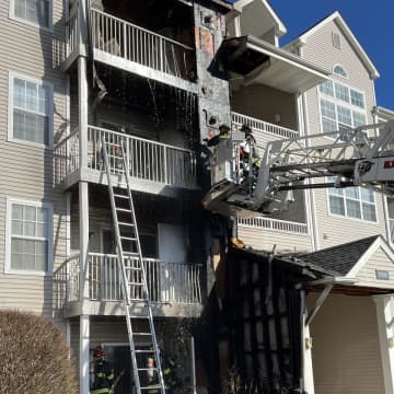 Four units of a Trumbull apartment building were damaged when a car struck a gas line at the complex, setting off a fire.