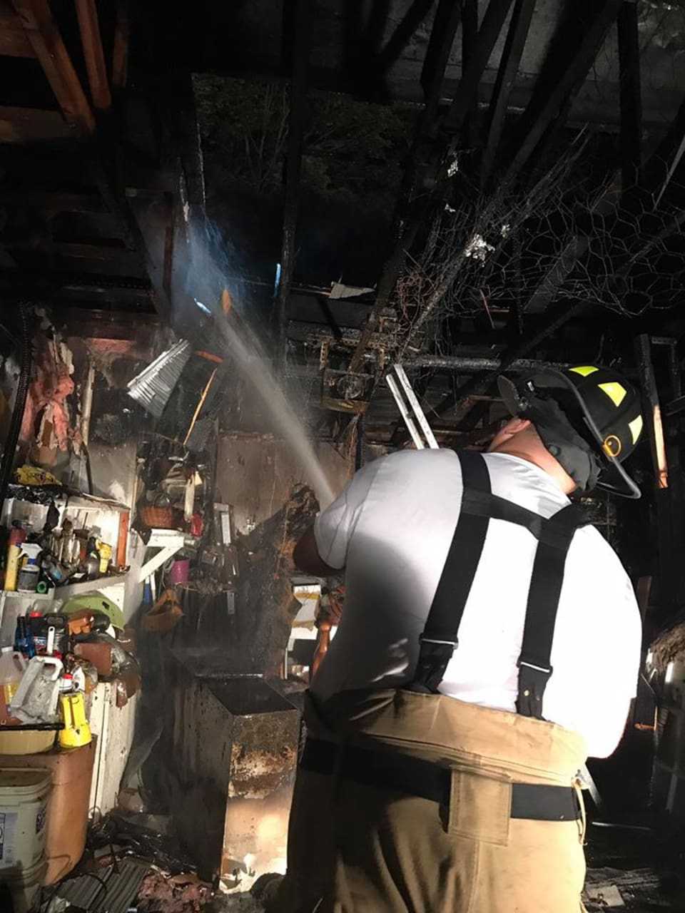 Firefighters in Bethel were able to put out a garage fire before it spread to the attached house on Thursday night.