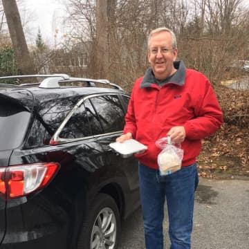 Mark Nathan, a coordinator for Lewisboro Meals on Wheels, makes a lunch delivery to a local resident.