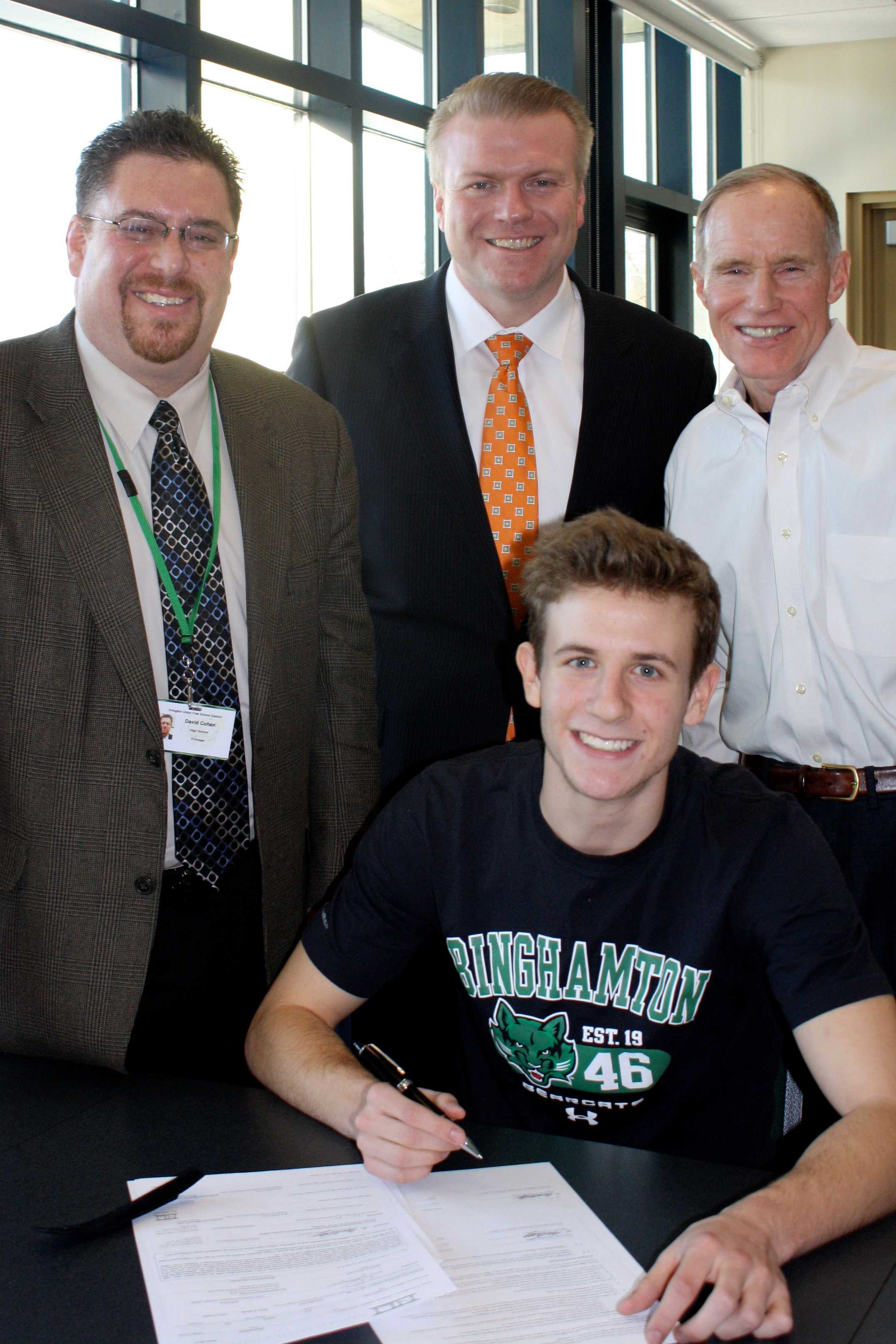 Irvington High School senior Ben Ovetsky, front, signs his National Letter of Intent to play Division I soccer for Binghamton University. Principal David Cohen, Superintendent Dr. 
Kristopher Harrison & former principal Scott Mosenthal look on.
