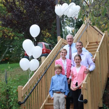 Thomas Gillespie stands with family at the Stair Dedication Center at The Inn, Waveny LifeCare Networks independent living residence. See story for photo IDs.