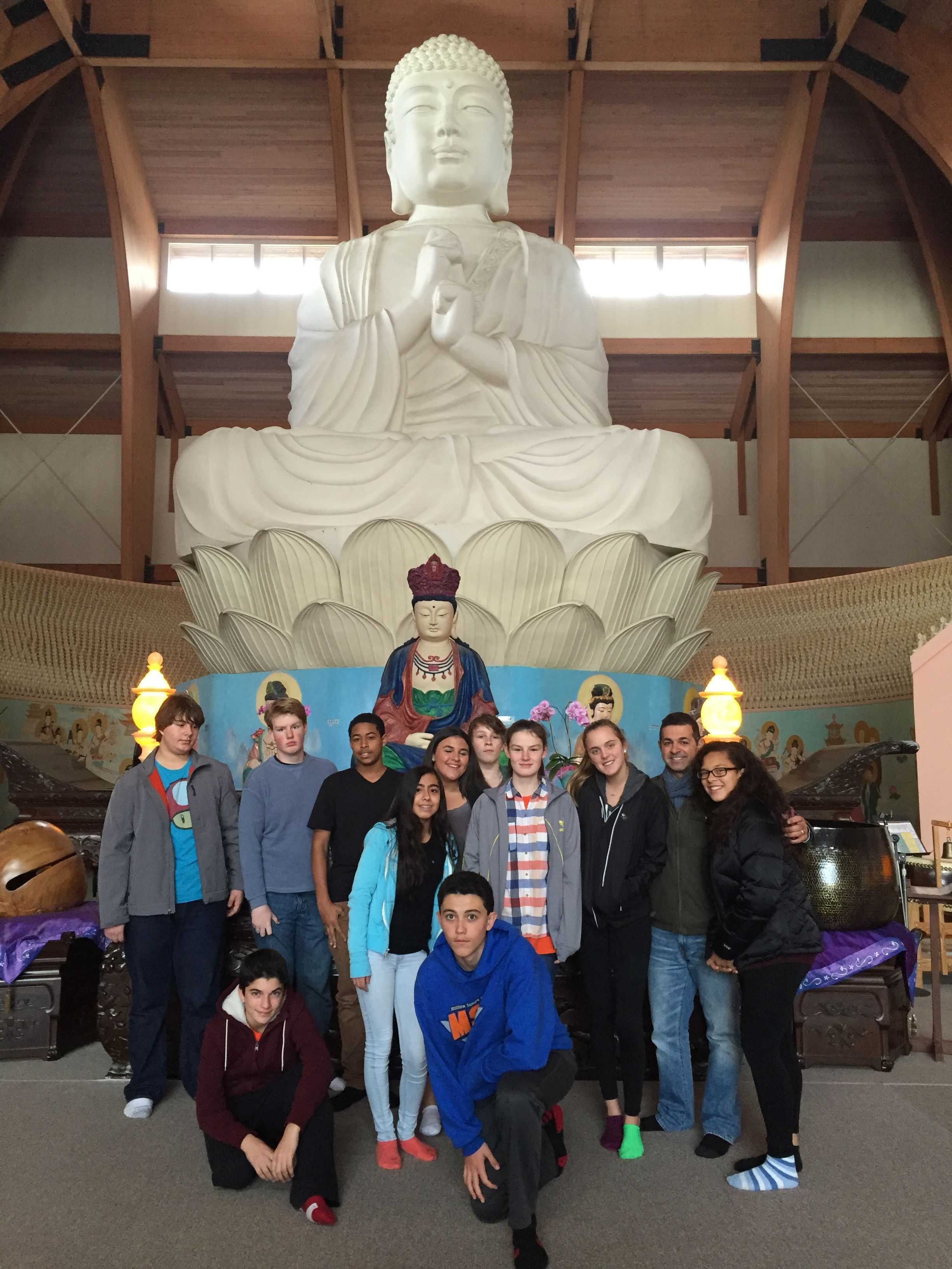 Briarcliff High School students pose with the largest Buddha statue in the Western Hemisphere at Chuang Yen Buddhist Monastery in Kent. 