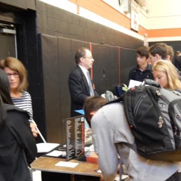 Tuckahoe students collaborating with college recruiters at the annual College Fair.