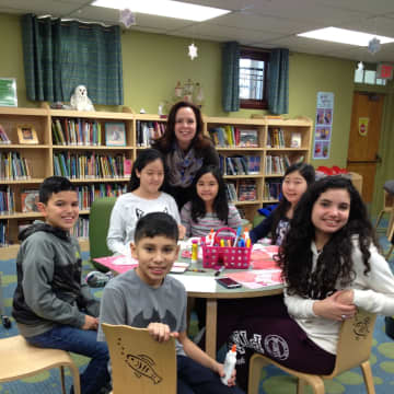 Children's Librarian Maria Russo with some kids at East Rutherford Library.