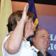 Ridgewood Police Chief Jacqueline Luthcke takes her oath while standing next to her husband, Wayne