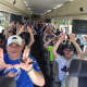 HHK UnPlugged holds up its "U" on the way to the Mets game.