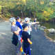 Some of Ho-Ho-Kus UnPlugged's boys get ready to jump into the water after a hike at the Ramapo Reservation.