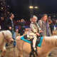 A young HHK UnPlugged participant rides a pony at the Big Apple Circus.