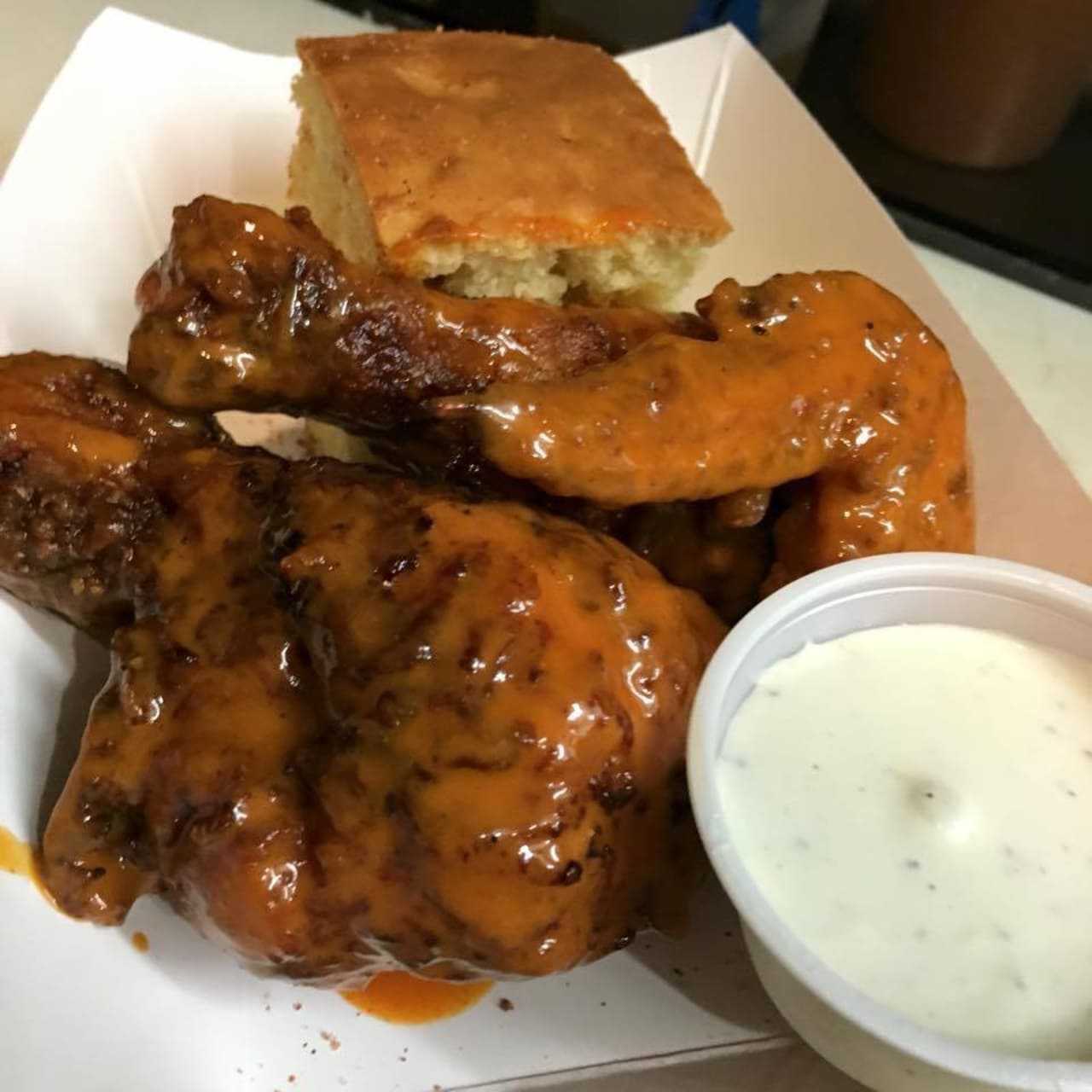 "Buffed Up" fried chicken - moist but crispy fried chicken smothered in house made Buffalo sauce.
