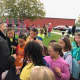 Port Jervis officers hand out treats to students at Anna S. Kuhl Elementary School after the walking school bus event.