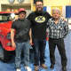 Rutledge Wood, co-host of “Top Gear” on The History Channel, with Chuck Wanamaker III, left, and Chuck Wanamaker Jr. at the Keystone Big Show East. They're standing in front of the Wanamakers' '55 Chevy.