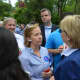 Hillary Clinton meets with a supporter in Chappaqua moments prior to the start of the 2016 Memorial Day parade.
