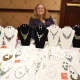 Another vendor shows off an array of jewelry choices — always a favorite gift for the holidays.